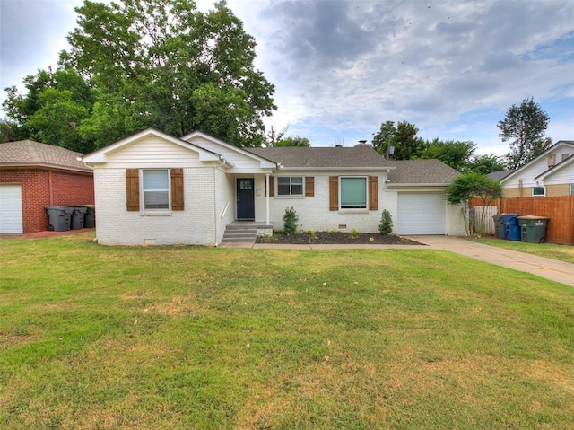 ranch-style house featuring a front yard and a garage