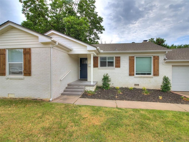 ranch-style home with a garage and a front yard