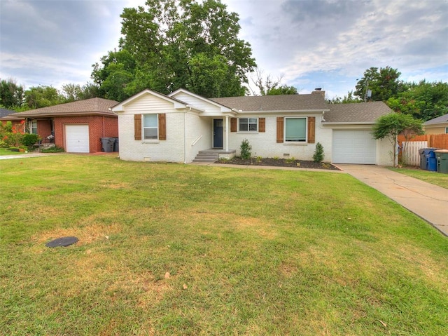 ranch-style home featuring a garage and a front lawn