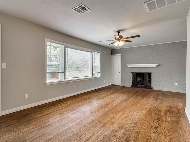 unfurnished living room with ceiling fan and hardwood / wood-style flooring