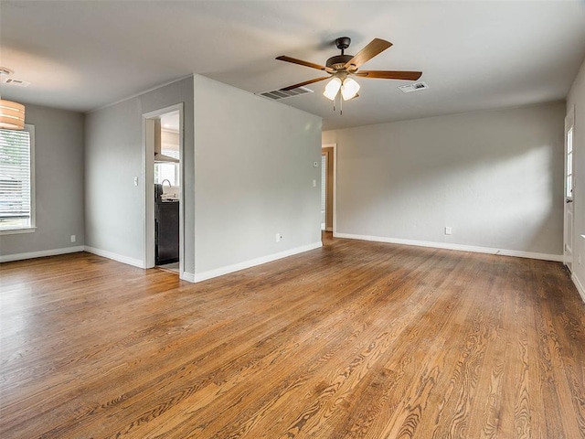 spare room with ceiling fan and light hardwood / wood-style floors