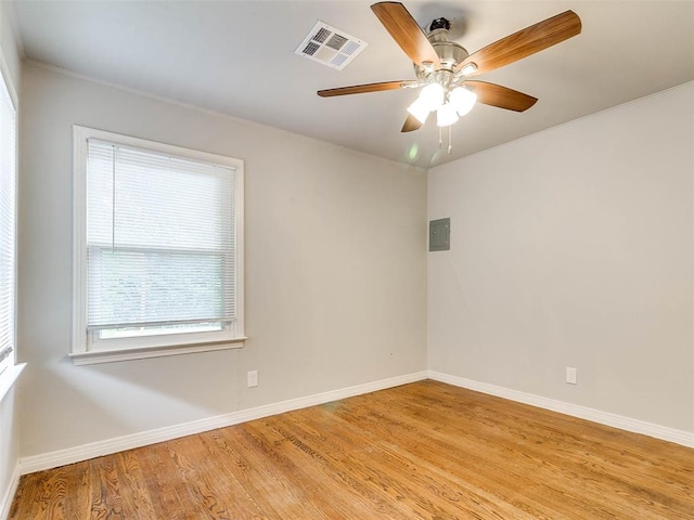 spare room featuring light hardwood / wood-style floors and ceiling fan