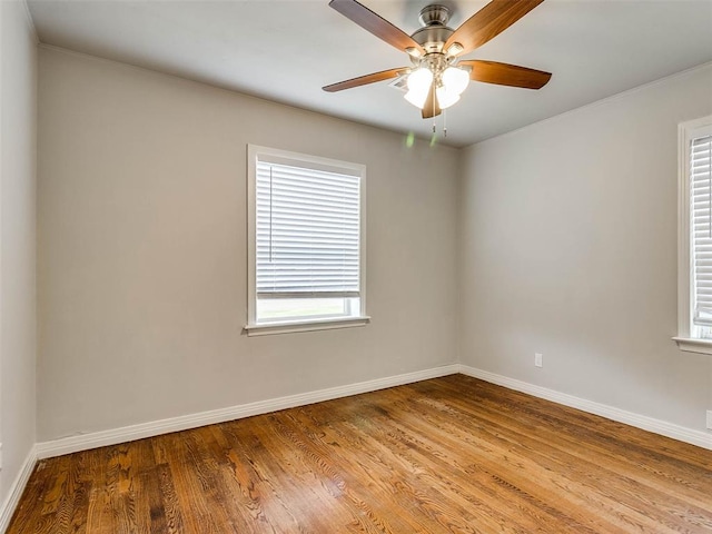 unfurnished room with hardwood / wood-style flooring and ceiling fan