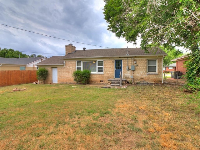 back of house with a yard