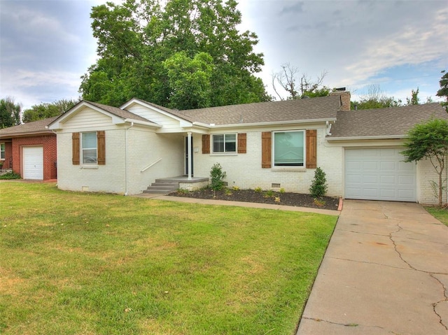 ranch-style home with a front yard and a garage