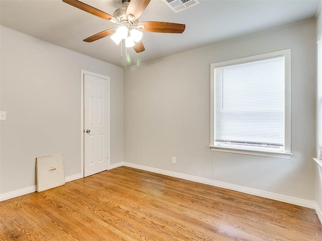 unfurnished room featuring ceiling fan and light wood-type flooring