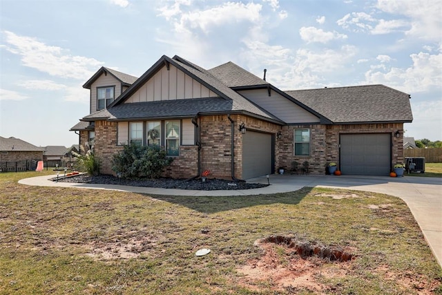 view of front of property with a front lawn and a garage