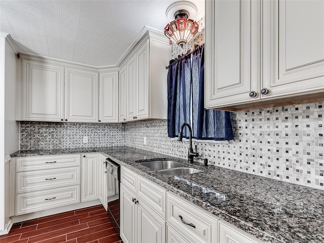 kitchen featuring white cabinets, sink, decorative backsplash, black dishwasher, and dark hardwood / wood-style flooring