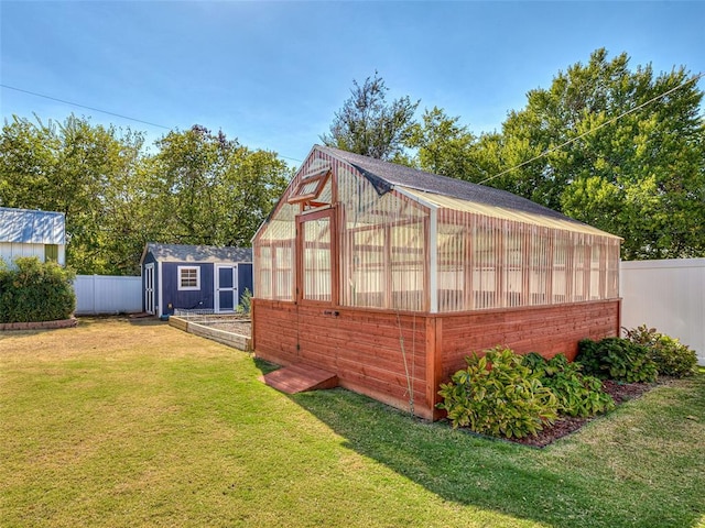 view of outdoor structure with a lawn