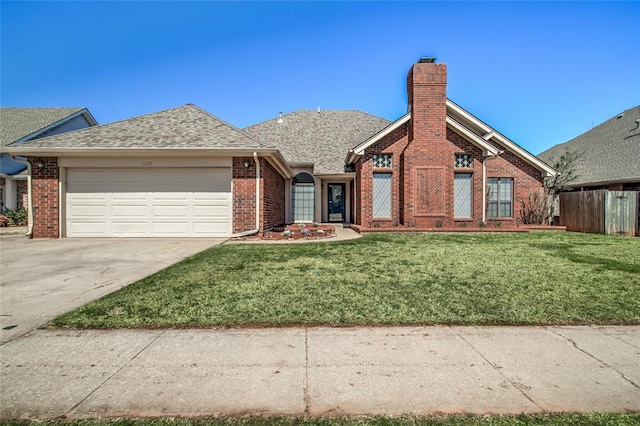 view of front facade featuring a front yard and a garage