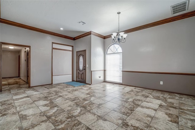 entrance foyer featuring a chandelier and ornamental molding