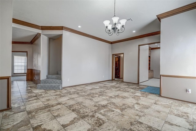 spare room with a chandelier and ornamental molding