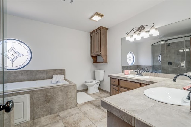 full bathroom with tile patterned floors, vanity, independent shower and bath, and toilet