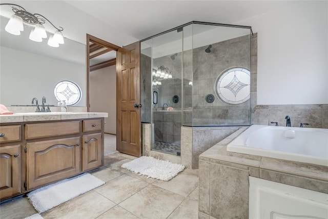 bathroom with plus walk in shower, vanity, and tile patterned floors