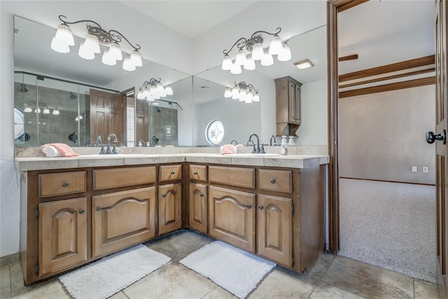 bathroom with vanity and a shower with shower door