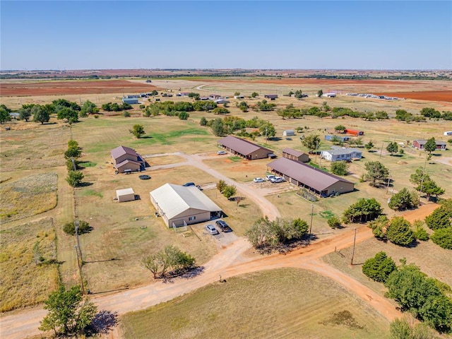 birds eye view of property with a rural view