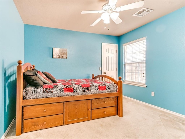 bedroom featuring ceiling fan and light colored carpet