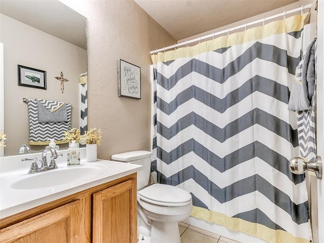 bathroom featuring a shower with curtain, tile patterned flooring, vanity, and toilet