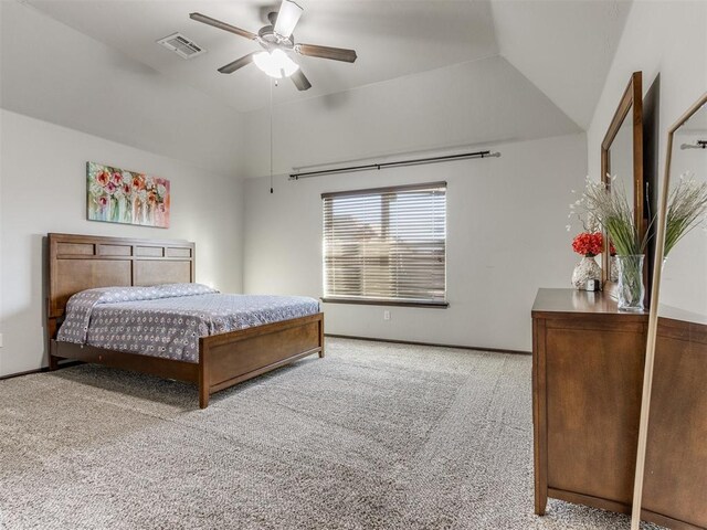 carpeted bedroom with ceiling fan and lofted ceiling