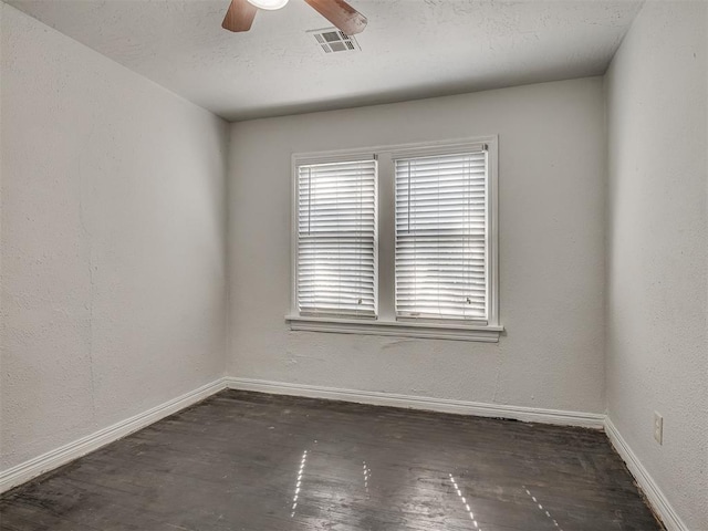 unfurnished room with ceiling fan and dark hardwood / wood-style floors