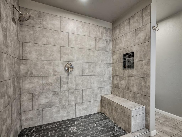 bathroom featuring tiled shower