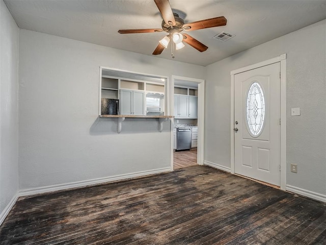 foyer entrance with dark hardwood / wood-style flooring and ceiling fan