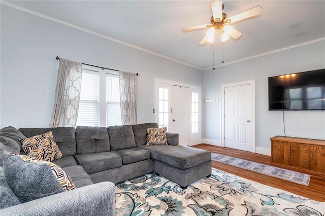 living room featuring ceiling fan, crown molding, and hardwood / wood-style flooring