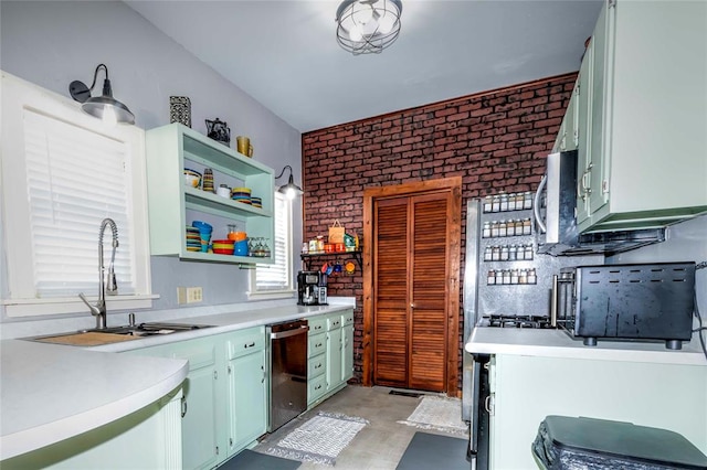 kitchen with dishwasher, sink, and brick wall