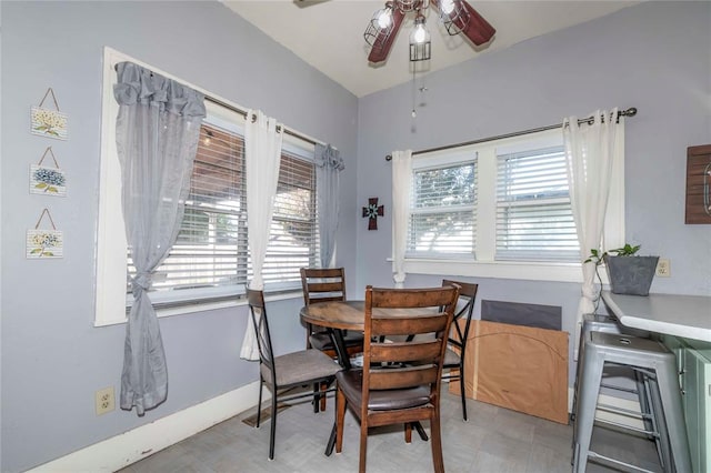 dining space with ceiling fan and a healthy amount of sunlight