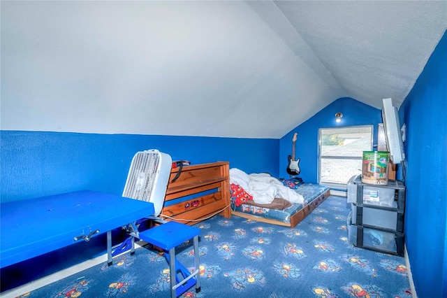 carpeted bedroom featuring lofted ceiling