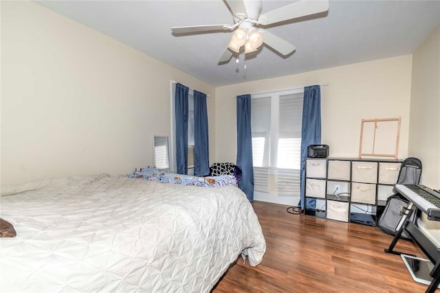 bedroom featuring hardwood / wood-style floors and ceiling fan