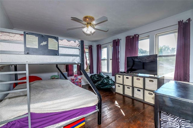 bedroom featuring ceiling fan and dark hardwood / wood-style flooring