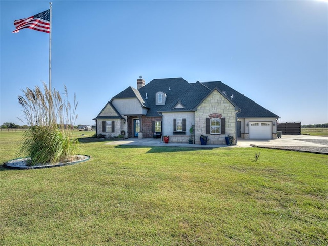 french country inspired facade with a front yard and a garage