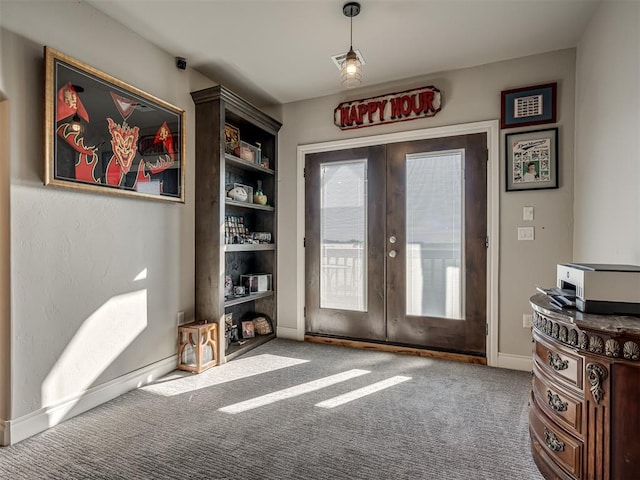 doorway to outside with carpet flooring and french doors