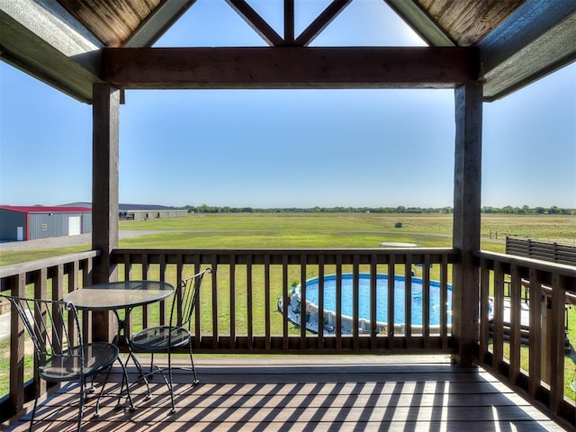 deck featuring a lawn