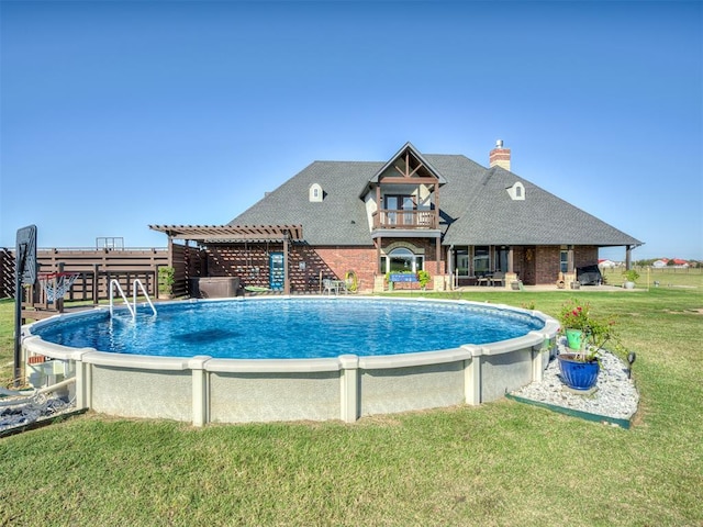 view of pool featuring a yard and a pergola