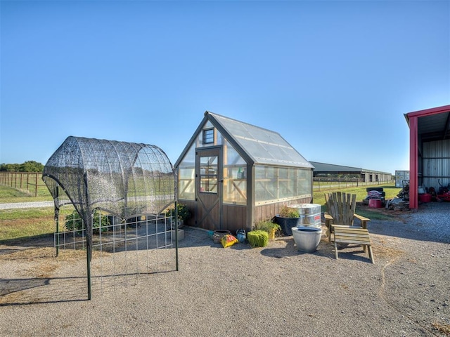 view of playground with an outbuilding