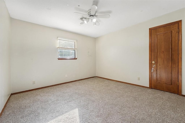 carpeted empty room featuring ceiling fan