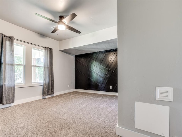 carpeted empty room with ceiling fan