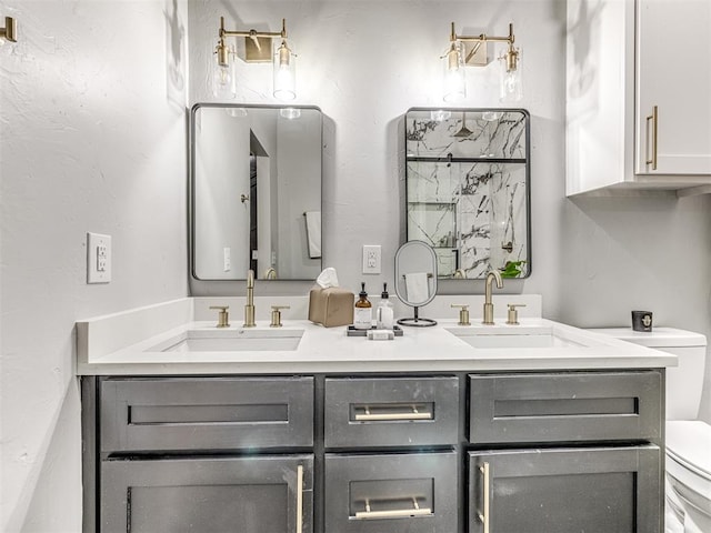 bathroom featuring a shower, vanity, and toilet