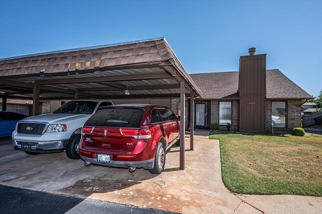 view of parking / parking lot with a carport and a lawn