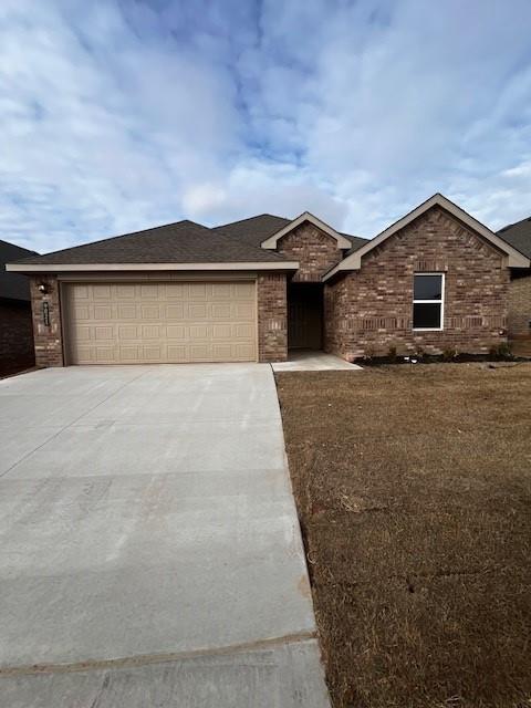 ranch-style house featuring a garage