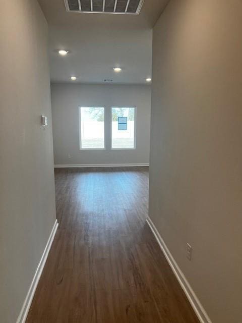 hall with dark hardwood / wood-style floors