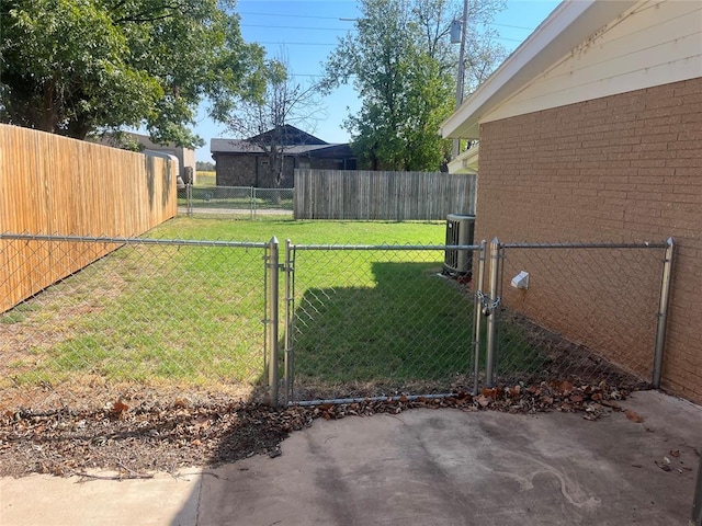 view of yard with central AC