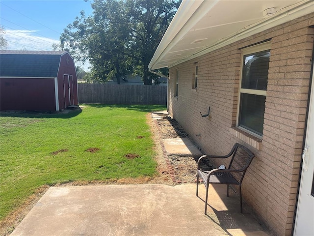 view of yard with a patio area and a storage shed