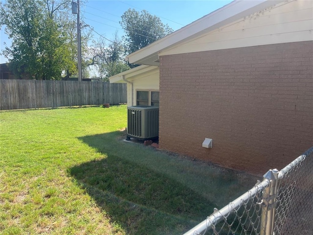 view of yard with central AC