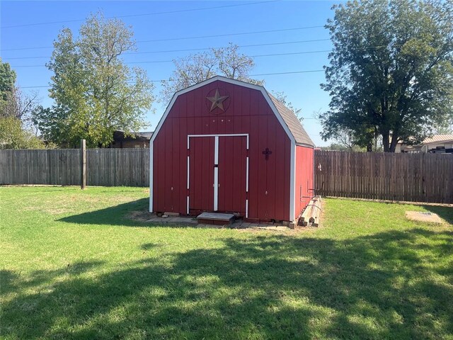 view of outbuilding featuring a lawn