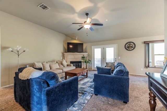 carpeted living room with french doors, vaulted ceiling, and ceiling fan