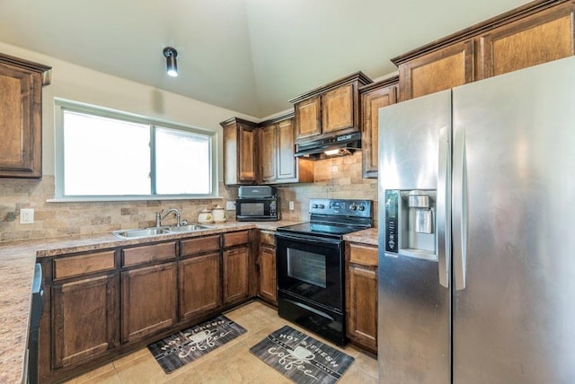 kitchen featuring black appliances, sink, decorative backsplash, light tile patterned floors, and light stone counters