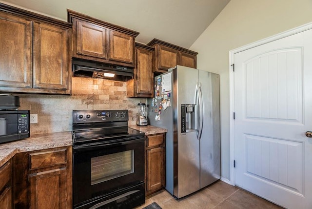 kitchen featuring tasteful backsplash, light tile patterned flooring, black appliances, and vaulted ceiling